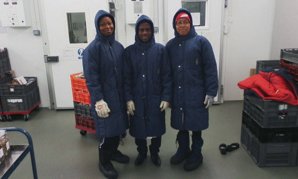 Three training course participants wearing personal protective equipment